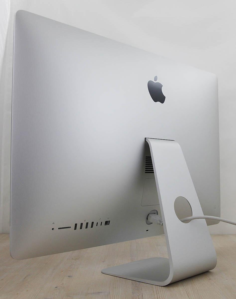 The iMac Core i9 3.6 27-Inch Aluminum (Retina 5K, 2020/Comet Lake; AMD Radeon Pro 5700 8gb) features a 14-nm Comet Lake 3.6GHz Intel Core i9 processor (I9-10910) with *ten* independent processor cores on a single chip, a 20 MB shared level 3 cache, a T2 Security Chip, 64GB of *easy to upgrade* 2666 MHz DDR4 SDRAM, a 1Tbytes SSD, and a Radeon Pro 5700 graphics processor wth 8 GB of dedicated GDDR6 video memory. It also has a built-in 1080p FaceTime HD webcam, a studio-quality three-mic array, and stereo speakers. This model has a 27\" *5120x2880* LED-backlit 16:9 widescreen IPS DCI-P3 Retina 5K display with True Tone technology. The rear of the case is aluminum and is thicker in the middle and tapers to a razor thin 5 mm at the edges. Connectivity includes four USB 3.0 ports, dual Thunderbolt 3 (USB-C) ports, Gigabit Ethernet, 802.11ac Wi-Fi, and Bluetooth 5.0.