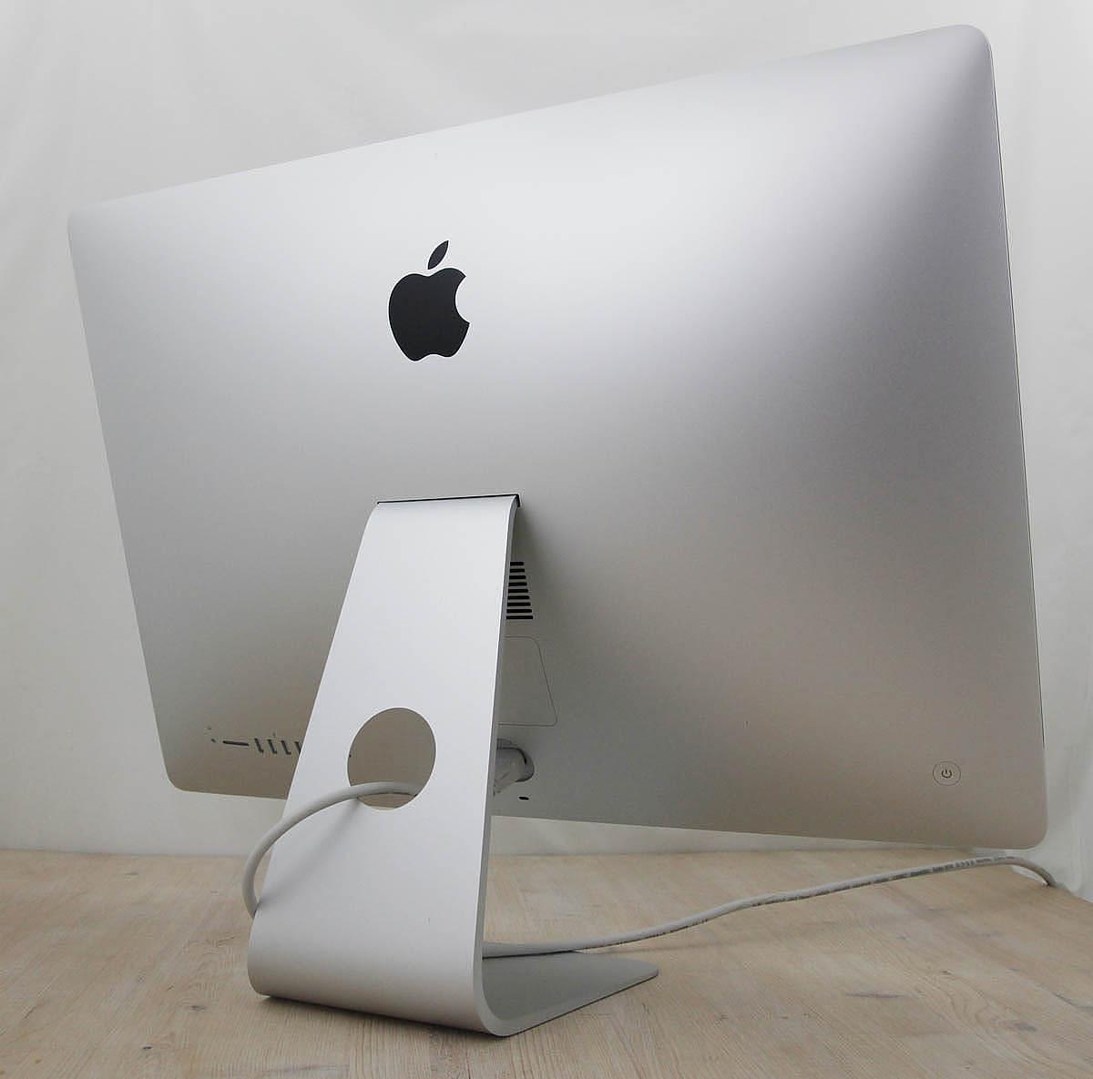 The iMac Core i9 3.6 27-Inch Aluminum (Retina 5K, 2020/Comet Lake; AMD Radeon Pro 5700 8gb) features a 14-nm Comet Lake 3.6GHz Intel Core i9 processor (I9-10910) with *ten* independent processor cores on a single chip, a 20 MB shared level 3 cache, a T2 Security Chip, 64GB of *easy to upgrade* 2666 MHz DDR4 SDRAM, a 1Tbytes SSD, and a Radeon Pro 5700 graphics processor wth 8 GB of dedicated GDDR6 video memory. It also has a built-in 1080p FaceTime HD webcam, a studio-quality three-mic array, and stereo speakers. This model has a 27\" *5120x2880* LED-backlit 16:9 widescreen IPS DCI-P3 Retina 5K display with True Tone technology. The rear of the case is aluminum and is thicker in the middle and tapers to a razor thin 5 mm at the edges. Connectivity includes four USB 3.0 ports, dual Thunderbolt 3 (USB-C) ports, Gigabit Ethernet, 802.11ac Wi-Fi, and Bluetooth 5.0.