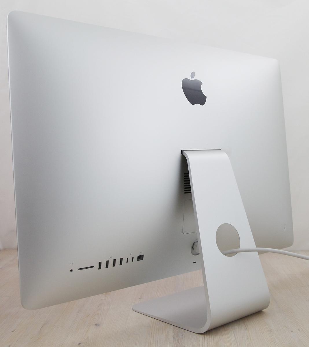 The iMac Core i9 3.6 27-Inch Aluminum (Retina 5K, 2020/Comet Lake; AMD Radeon Pro 5700 8gb) features a 14-nm Comet Lake 3.6GHz Intel Core i9 processor (I9-10910) with *ten* independent processor cores on a single chip, a 20 MB shared level 3 cache, a T2 Security Chip, 64GB of *easy to upgrade* 2666 MHz DDR4 SDRAM, a 512Gb SSD, and a Radeon Pro 5700 graphics processor wth 8 GB of dedicated GDDR6 video memory. It also has a built-in 1080p FaceTime HD webcam, a studio-quality three-mic array, and stereo speakers. This model has a 27\" *5120x2880* LED-backlit 16:9 widescreen IPS DCI-P3 Retina 5K display with True Tone technology. The rear of the case is aluminum and is thicker in the middle and tapers to a razor thin 5 mm at the edges. Connectivity includes four USB 3.0 ports, dual Thunderbolt 3 (USB-C) ports, Gigabit Ethernet, 802.11ac Wi-Fi, and Bluetooth 5.0.